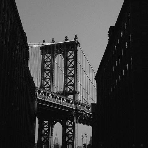black-and-white grayscale photography of bridge dumbo